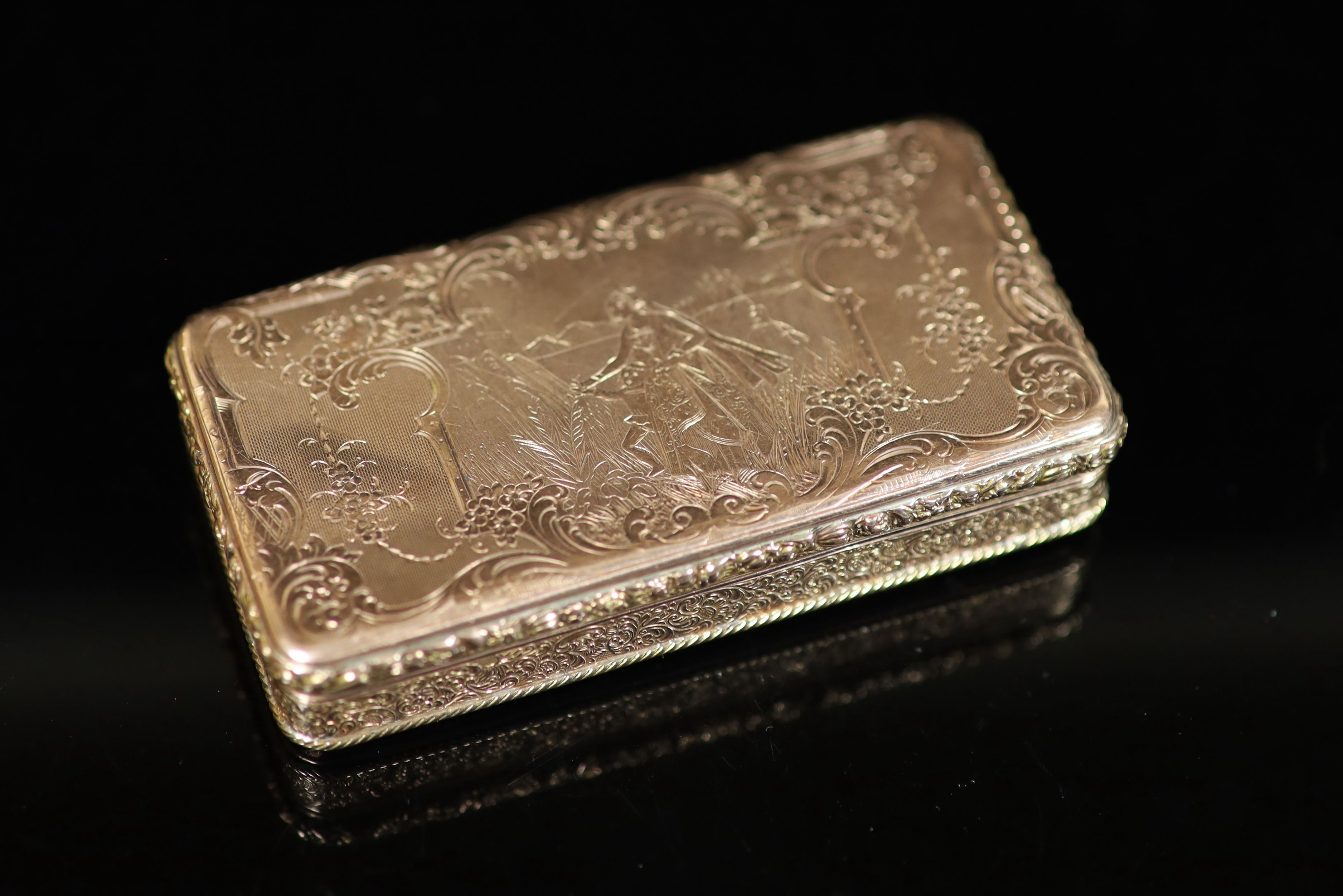 An early 19th century French engraved and engine turned gold rectangular snuff box, with hinged cover